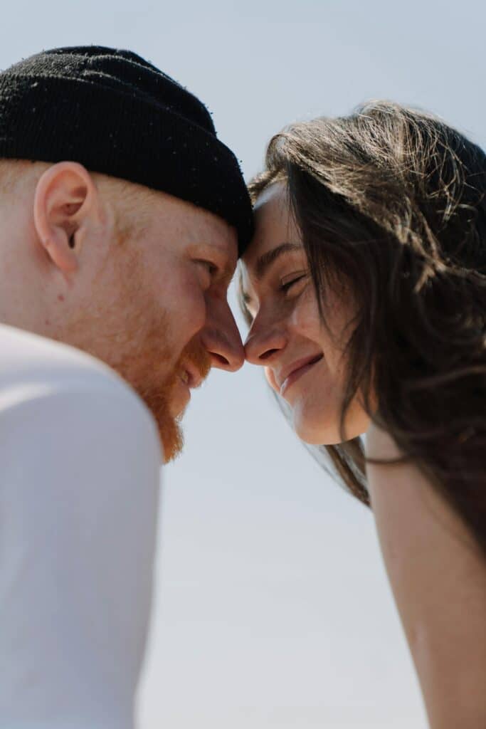 A man and woman together in natural light, representing everyday skincare routines.