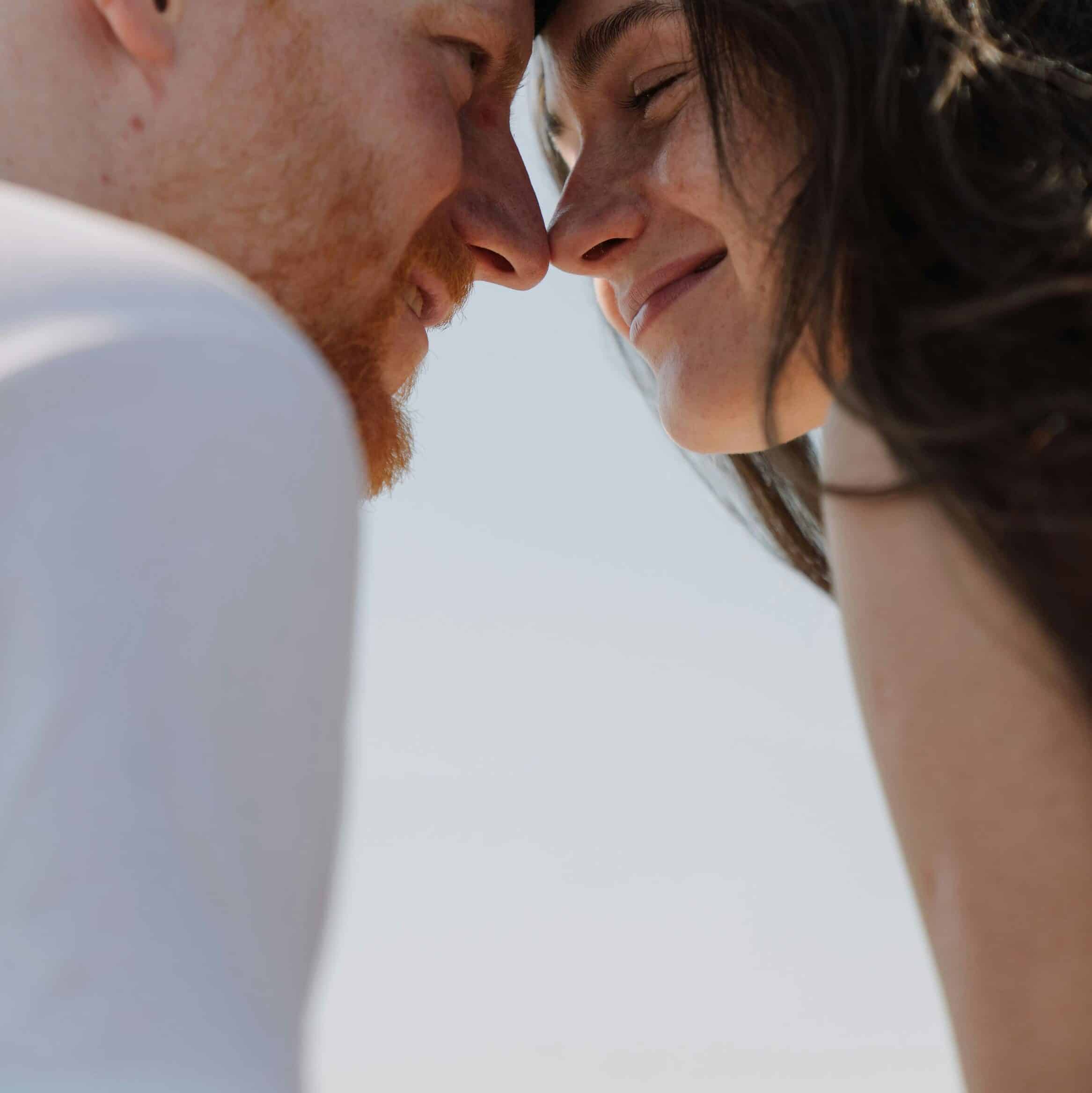 A man and woman together in natural light, representing everyday skincare routines.